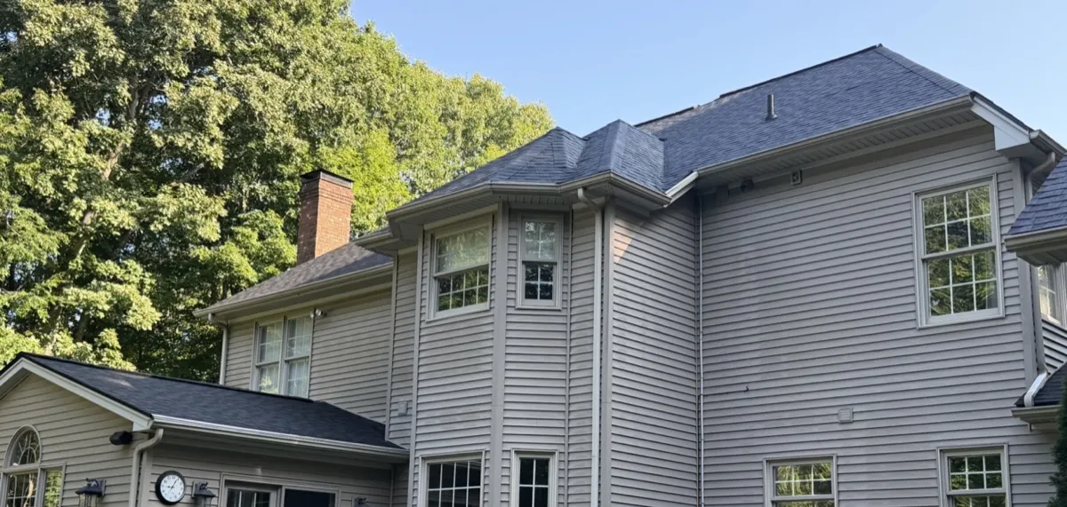 Before - weathered roof and original gutters on a Southbury, CT home