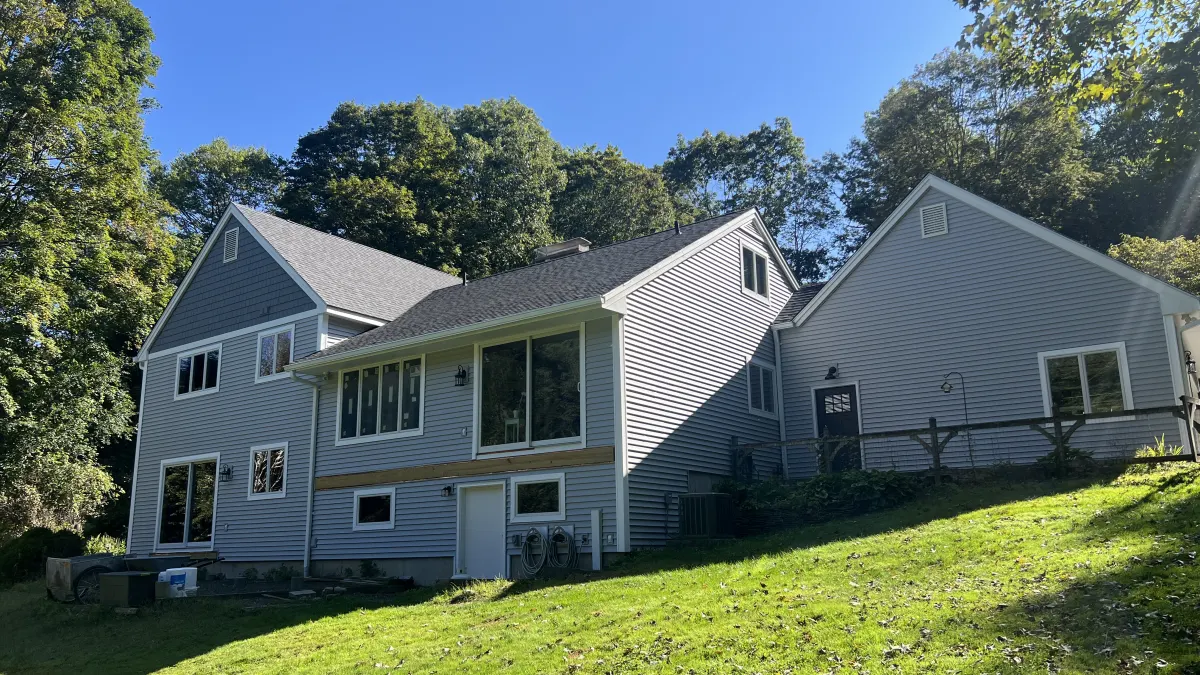 After - the same rear elevation in new gray vinyl siding installed by Martin's Aluminum in Southbury, CT