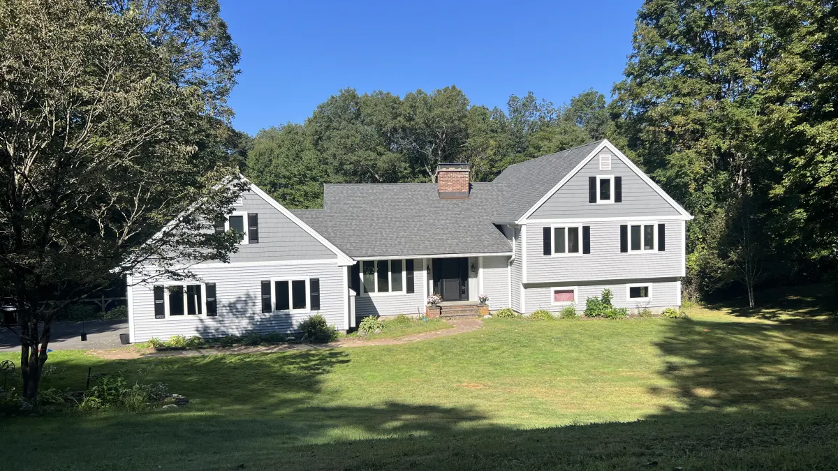 After - the full front elevation in new vinyl siding installed by Martin's Aluminum in Southbury, CT
