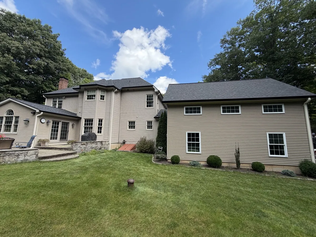 Seamless gutters and new architectural shingle roof on a Southbury, CT home by Martin's Aluminum