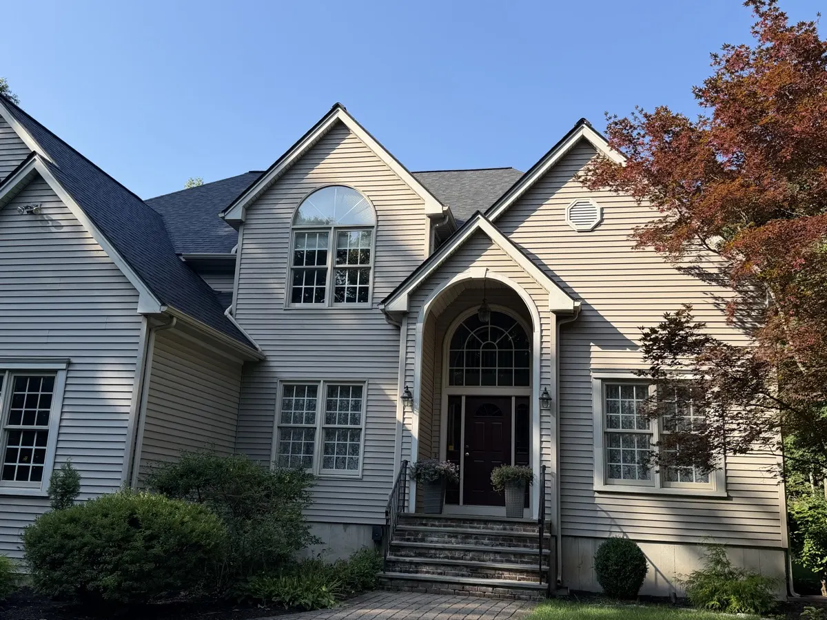 Seamless gutters along the front eaves and gables of a Southbury, CT colonial by Martin's Aluminum