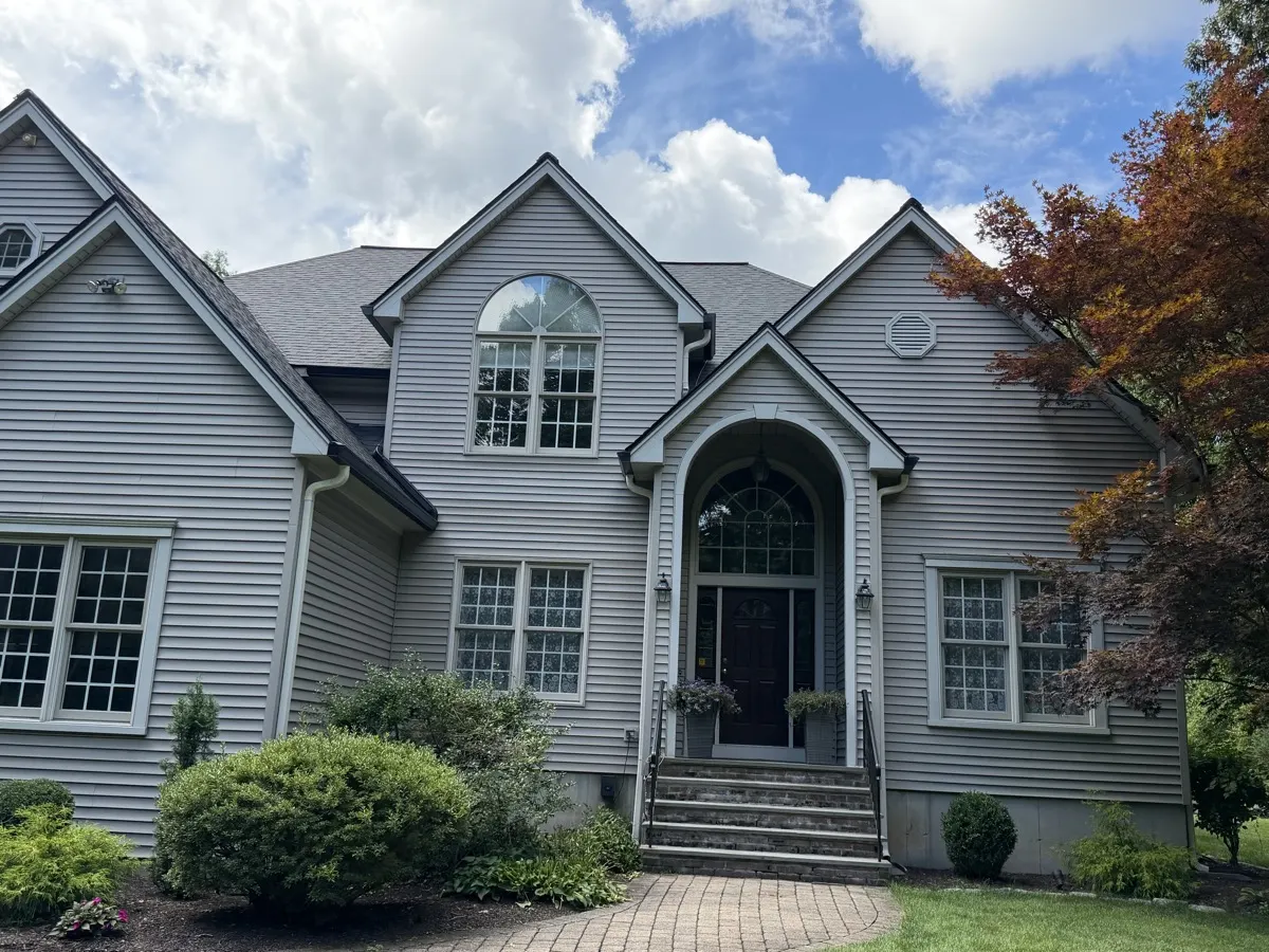Seamless gutters along the front gables of a Southbury, CT home by Martin's Aluminum